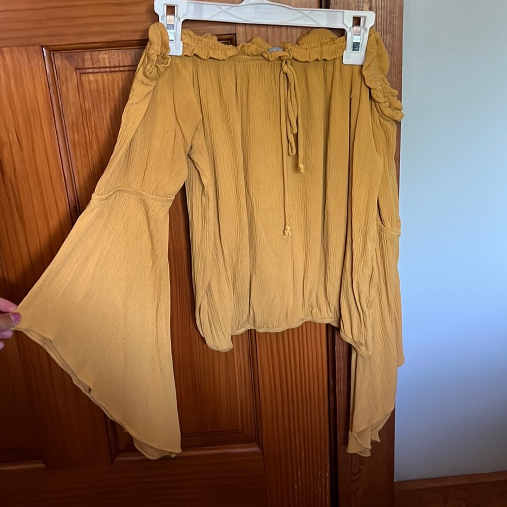 Off the shoulder, mustard yellow shirt